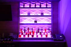 Banquet hall bar with purple LED controllable lighting by Paramount Construction and Contracting